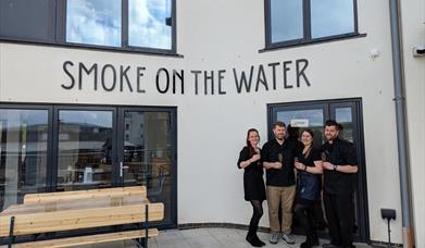 Owners of Smoke on the Water on the day of the official opening