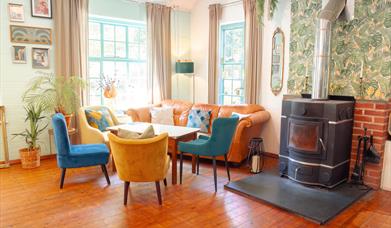 Inside the Blue Pool Tearooms - seating beside the log burner