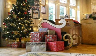 A Christmas sleigh and presents inside Durlston Castle