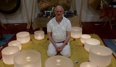 Dean Carter of centreforpuresound.org and his display of crystal singing bowls