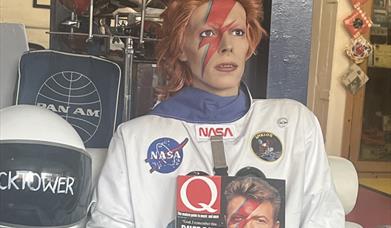 David Bowie Spaecman welcomes customers into Clcoktower Records