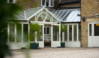 Front of hotel through leaves