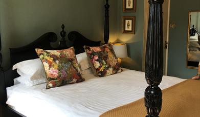 Four poster bedroom at The Bridge House in Bridport, Dorset