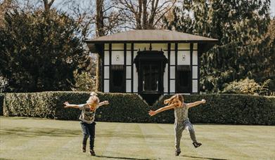 Children playing on main garden lawn