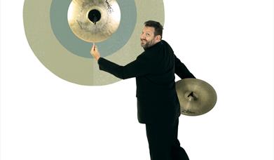 BSO Musician balancing a cymbal on his finger
