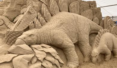 Sand sculpture of dinosaurs at SandWorld in Weymouth, Dorset