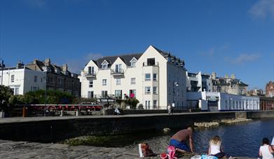 Quayside Court in Swanage, Dorset overlooks the Stone Quay and Victorian Swanage Pier.