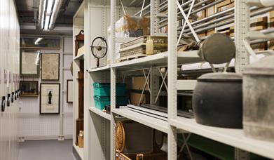 Photograph of shelving with museum objects on.