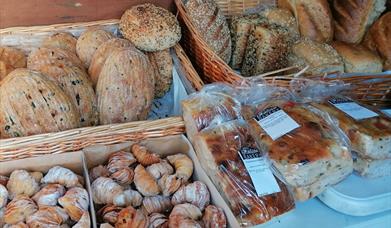 Bread and cakes for sale on The Italian Bakery stall at Swanage Market