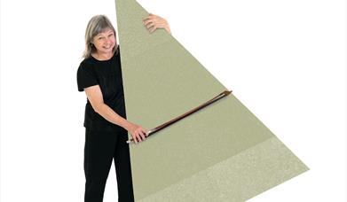A musician holding a bow in one hand and a graphic triangle in the other