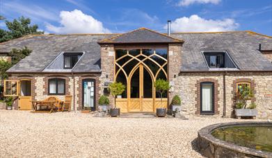 Front of Upton Grange Holiday Cottages, Reception either at main door or stable door (where office is situated)