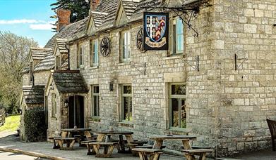 The front elevation of the Bankes Arms country Inn - purbeck stone walls and roof.