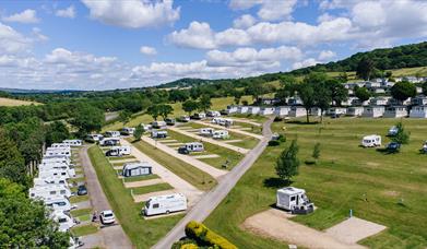 View of the touring pitches in the red field at Newlands Holiday Park