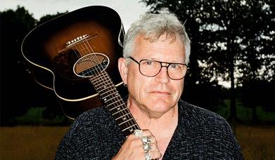 Robb Johnson with guitar