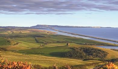 View from Abbotsbury of Chesil Beach and the Fleet lagoon - copyright Vertiworks